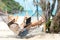 Lifestyle freelance woman using smartphone working and shopping on the beach.Â 